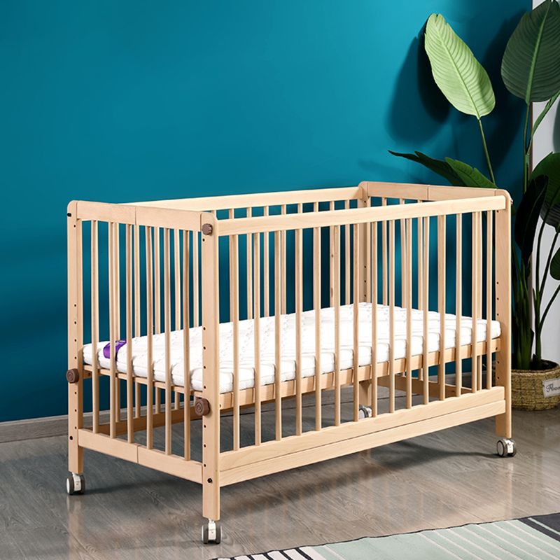 2-in-1 Folding Wooden Crib Natural Baby Crib with Mattress and Casters