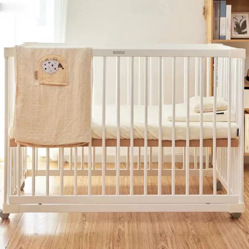 Scandinavian Crib with Guardrail White Wood with Casters/Wheels Nursery Crib