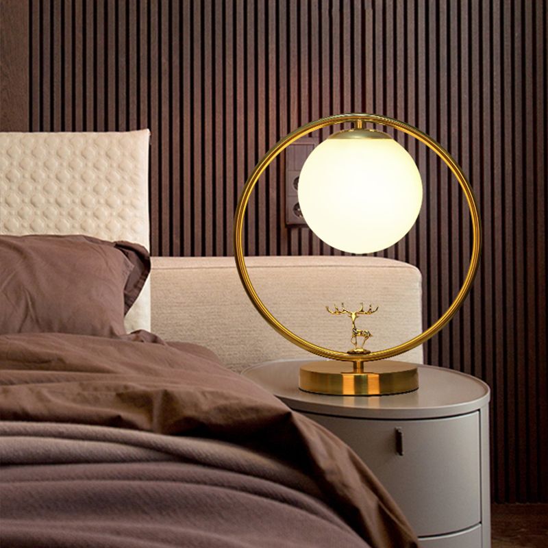 Ivory Glass Ball Table Light Simple Style 1-Light Gold Night Lamp with Metal Ring and Deer Deco