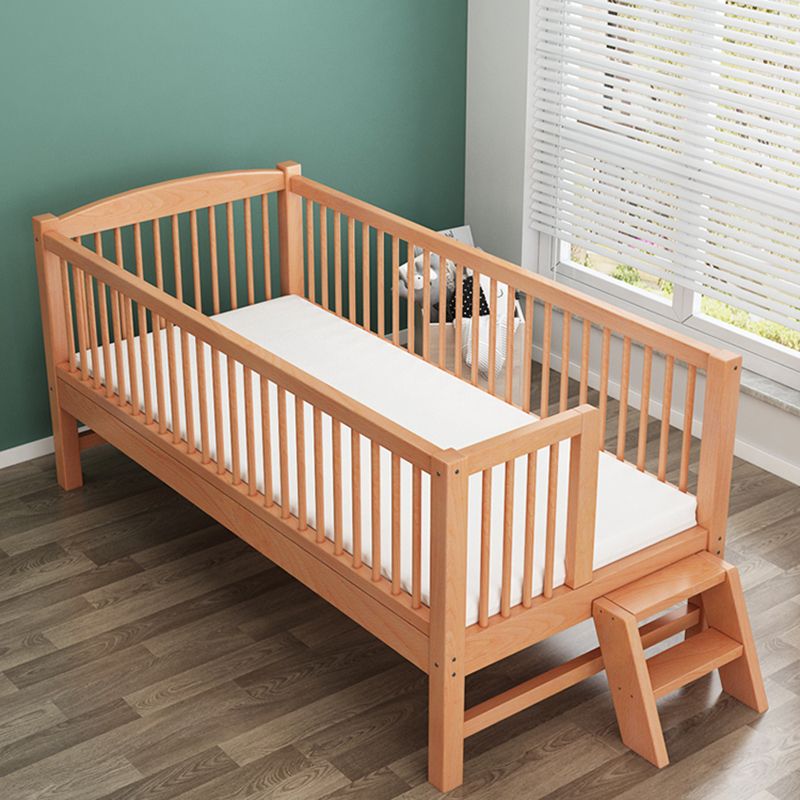 Functional Nursery Crib with Adjustable Height in Natural Wood