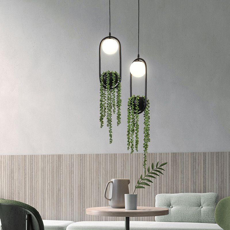 Zwart 1 Licht bolvormig Hanglamp Lichte Noordse retro ovale metalen ringschaduwhanglamp met groene plant