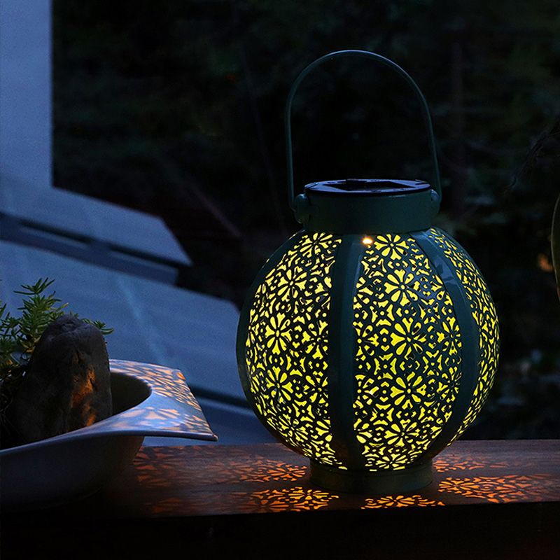 Sphere Hollowed Out Solar Table Lamp Simple Stylish Metal Garden LED Ground Light with Handle in Green