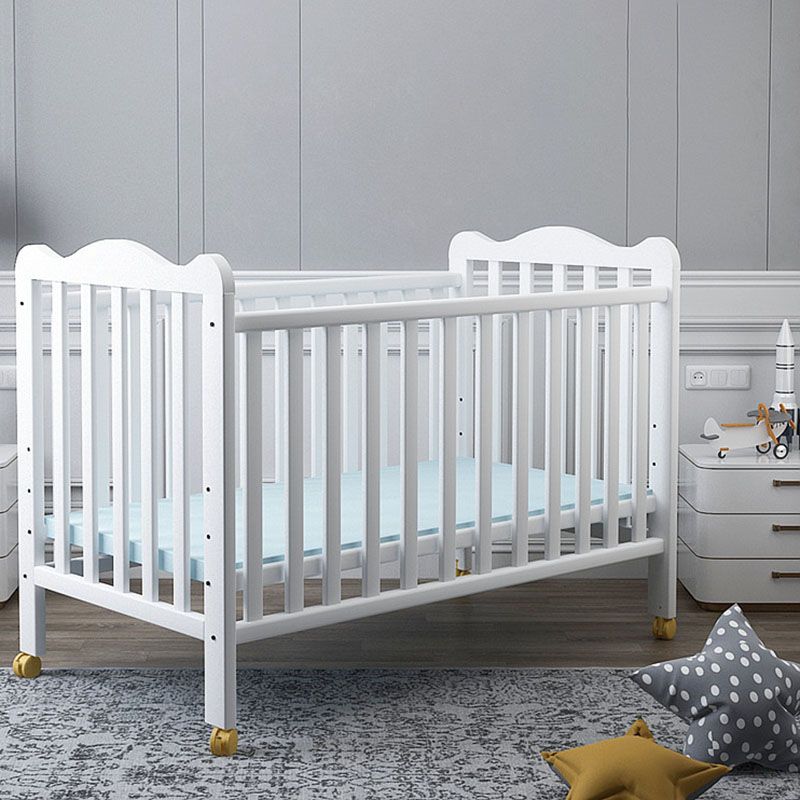 Farmhouse Wooden Baby Crib with Guardrail and Casters in Pine Wood