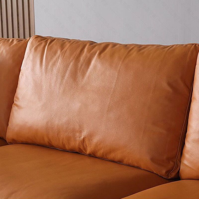 Ornate Leather Upholstery Orange Sofa with Pillow and Square Armrest Back Sectional