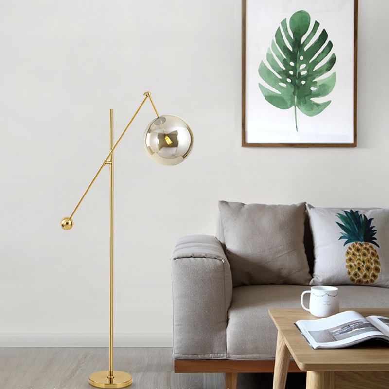 1-Bulb Living Room Floor Lamp Simple Gold Swing Arm Standing Light with Globe Smoke Grey Glass Shade