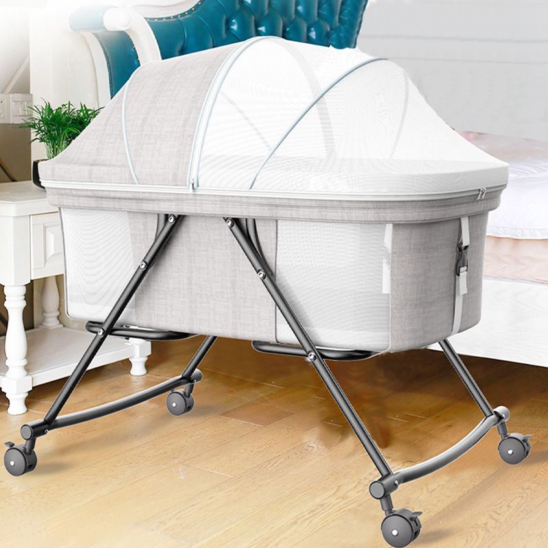 Modern Plastic Color Matching Oval Nursery Crib with Casters