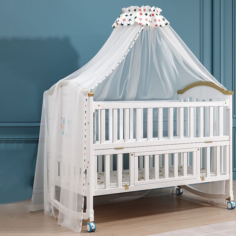 Contemporary White Baby Crib with Guardrail and Casters and Storage