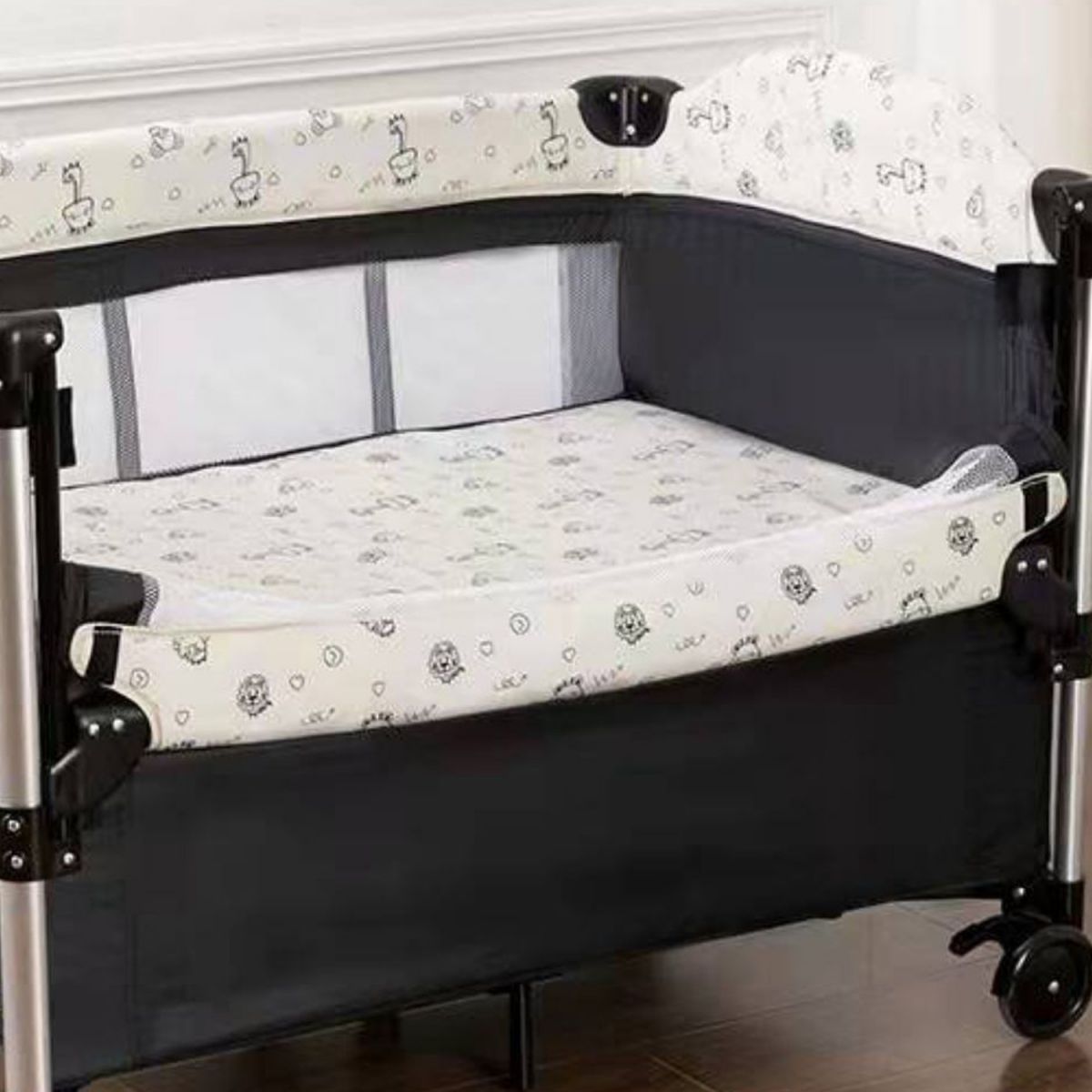 2-in-1 Folding Crib in Black Mini Crib With Wheels and Storage