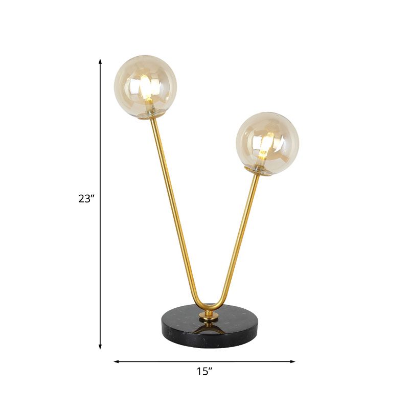 2 Bulbs Bedroom Table Light Post-Modern Black and Gold Night Lamp with Dual Ball Amber Glass Shade