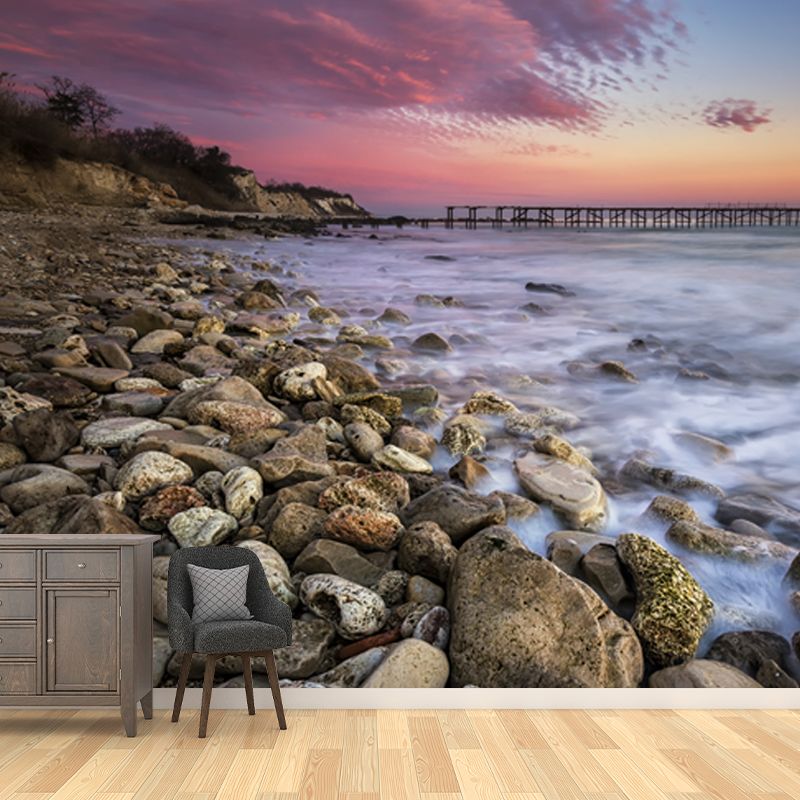 Pink-Blue Tropix Mural Full Size Rock Seashore with Distant Bridge at Dusk Wall Decor for Bedroom