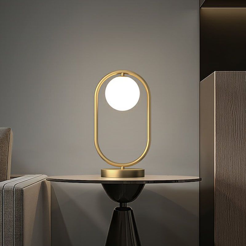 Minimalist Oval Frame Table Lighting Metal 1-Head Bedroom Night Light with Ball Milk Glass Shade in Gold