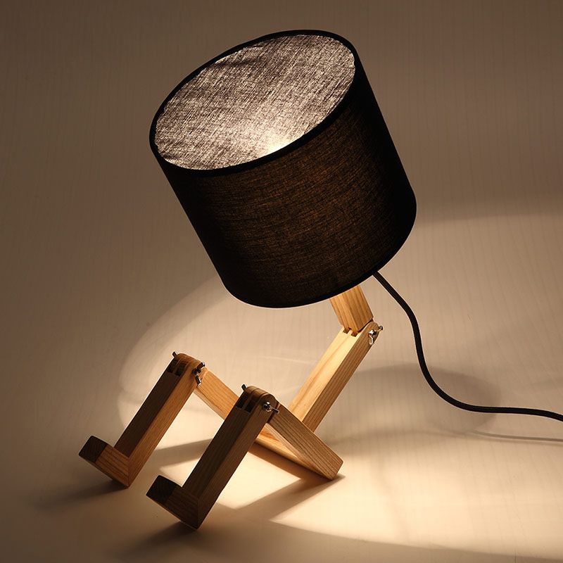 Lampe de table en forme d'homme Nouveauté en bois moderne Single Single Béges / noir / blanc Lumière de nuit avec conception de rack de livres et nuance de tissu de cylindre