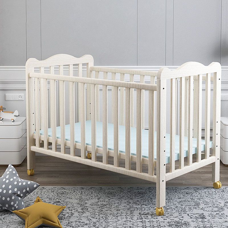 Farmhouse Wooden Baby Crib with Guardrail and Casters in Pine Wood