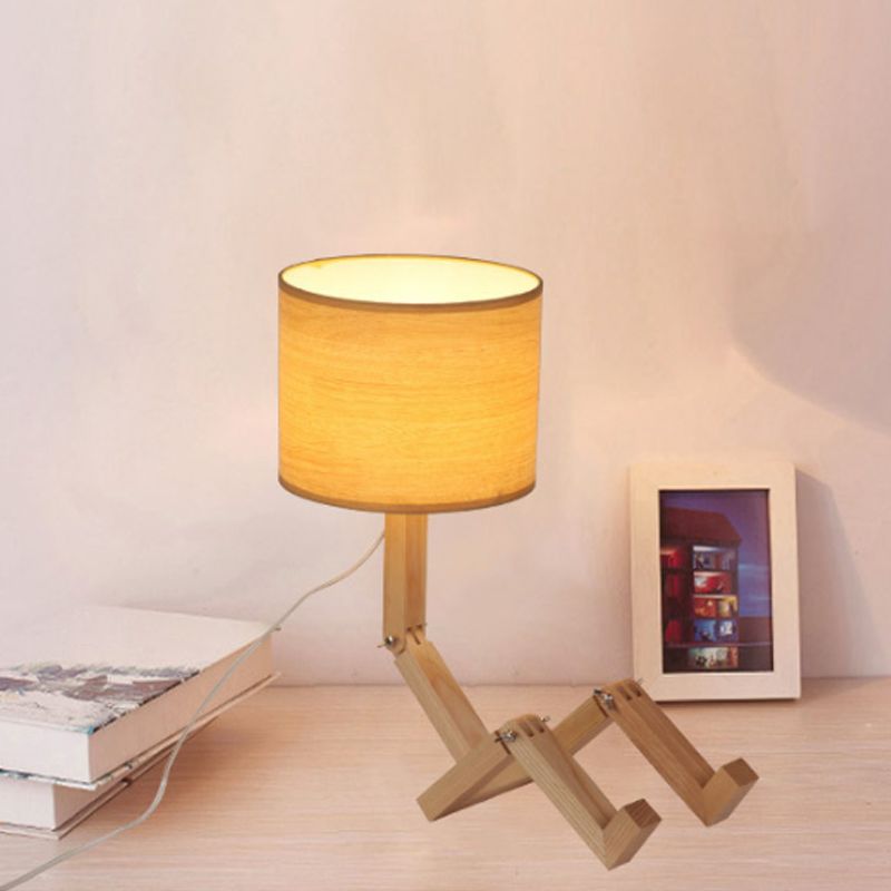 Lampe de table en forme d'homme Nouveauté en bois moderne Single Single Béges / noir / blanc Lumière de nuit avec conception de rack de livres et nuance de tissu de cylindre