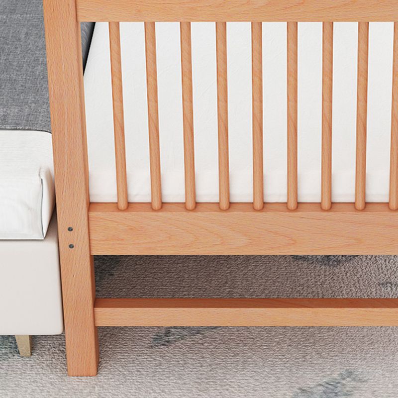 Functional Nursery Crib with Adjustable Height in Natural Wood