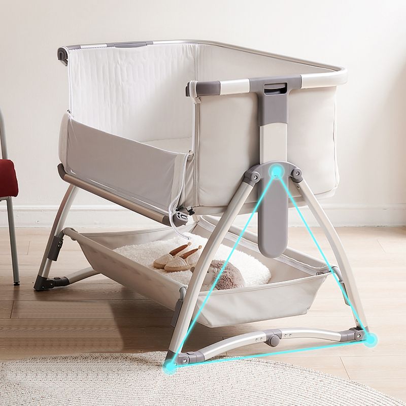 Gliding and Adjustable Metal Bassinet Oval Cradle with 4 Wheels and Storage Shelf