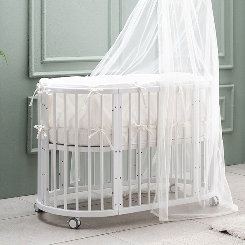 Oval Solid Wood Crib Nordic Style 5-In-1 Convertible Crib with Casters