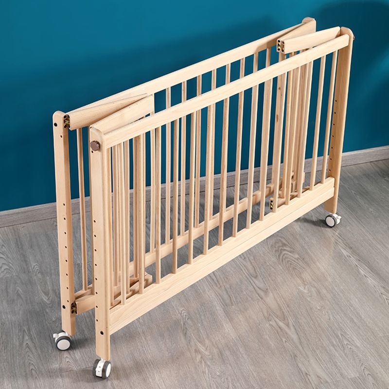 2-in-1 Folding Wooden Crib Natural Baby Crib with Mattress and Casters