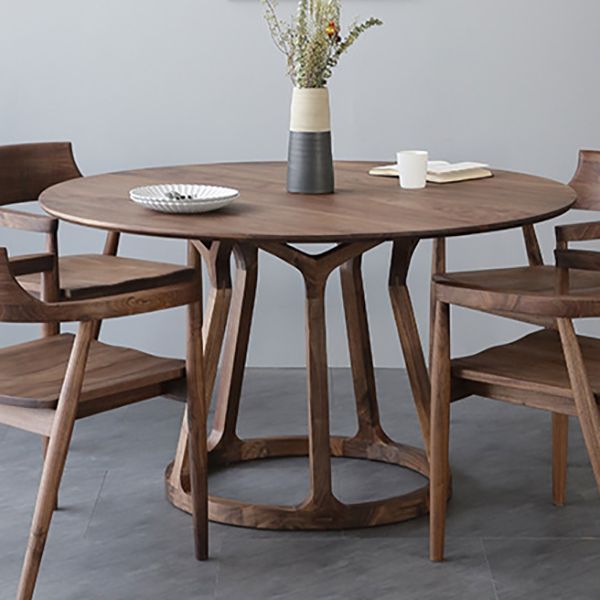 Table à manger en bois massif en pin rond avec piédestal en bois pour restaurant