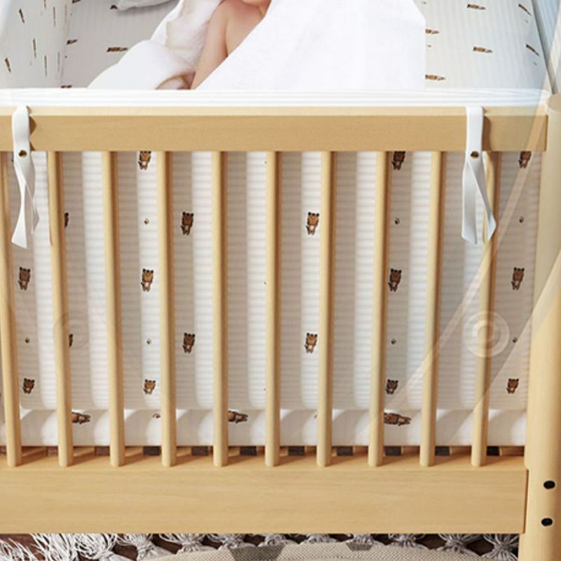 Modern Farmhouse Nursery Crib with Adjustable Height in Natural Wood