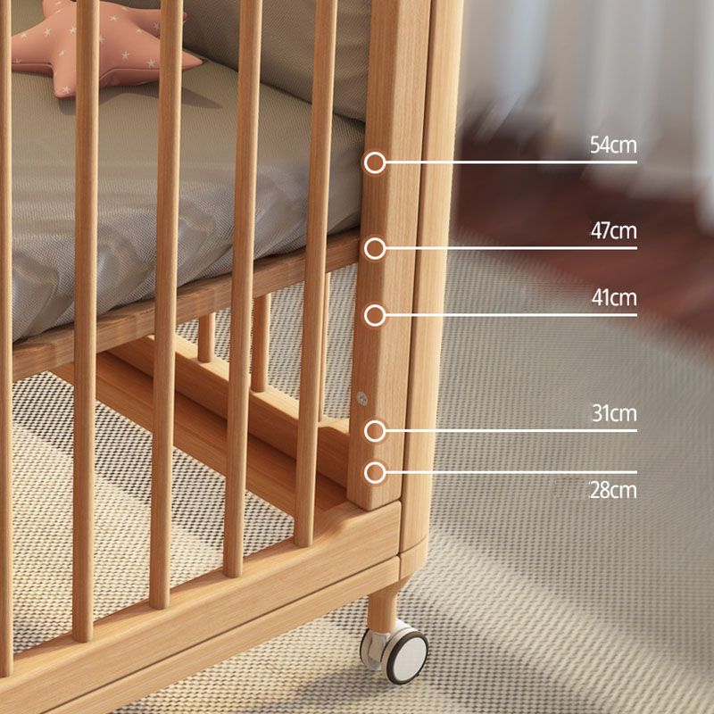 Contemporary Nursery Crib with Adjustable Height and Casters in Beech