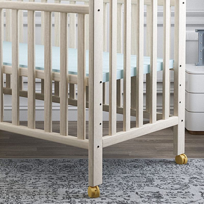 Scandinavian Wood Baby Crib Pine with Guardrail Nursery Crib with Wheels