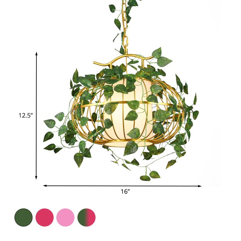 1 luminaire suspendu en métal clair usine rouge / rose / verte cage vers le bas éclairage avec de l'ombre en tissu et une fausse plante / fleur