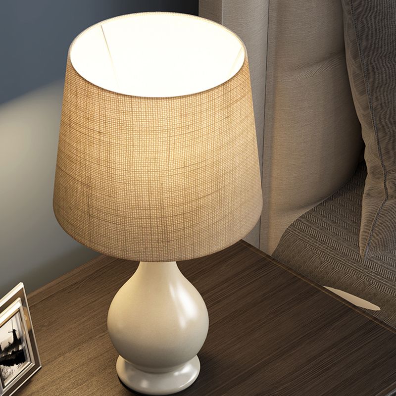 1 Bulb Conical Desk Lamp Countryside Beige Fabric Nightstand Light with White Vase Shape Base