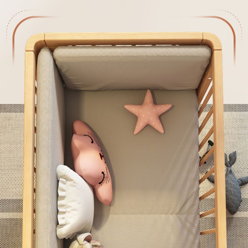 Contemporary Nursery Crib with Adjustable Height and Casters in Beech