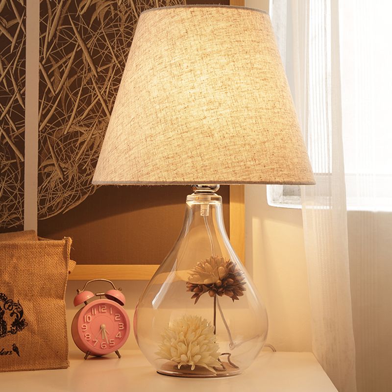 Modern 1 Head Table Light Clear Waterdrop/Bottle Glass Night Lighting with Dried Flower Decor and Flaxen Fabric Shade