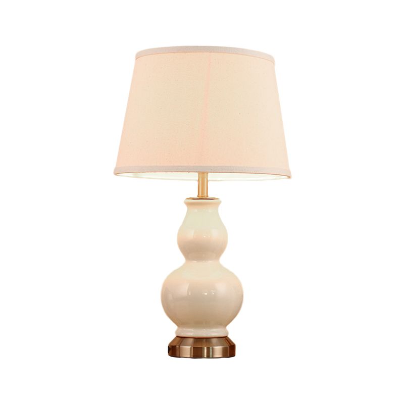 Compito curvo luce ceramica moderna 1 lampadina rosa/bianco lampada da comodino con tonalità in tessuto, 13 "/16" di larghezza