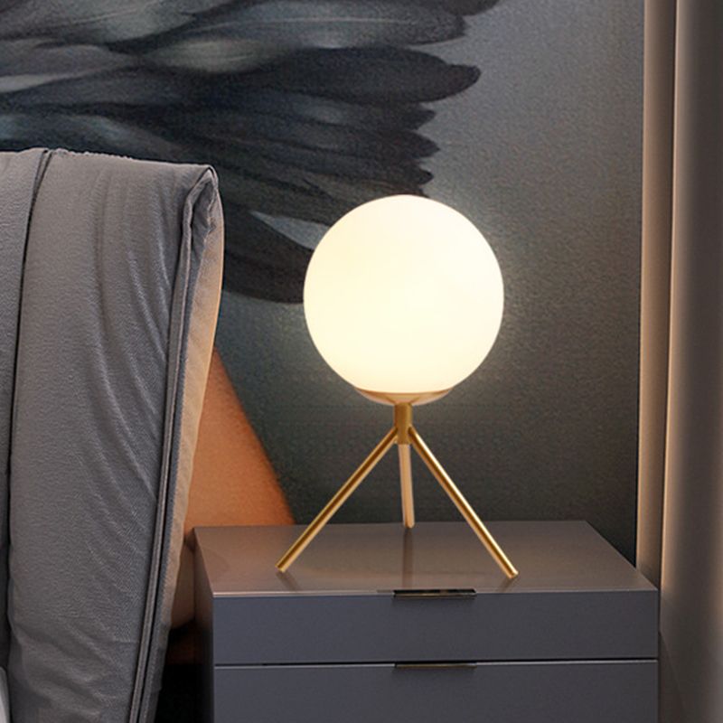 Opal Glass Sphere Desk Light Modern 1 Bulb Night Table Lamp in Gold/Black with Metal Tripod