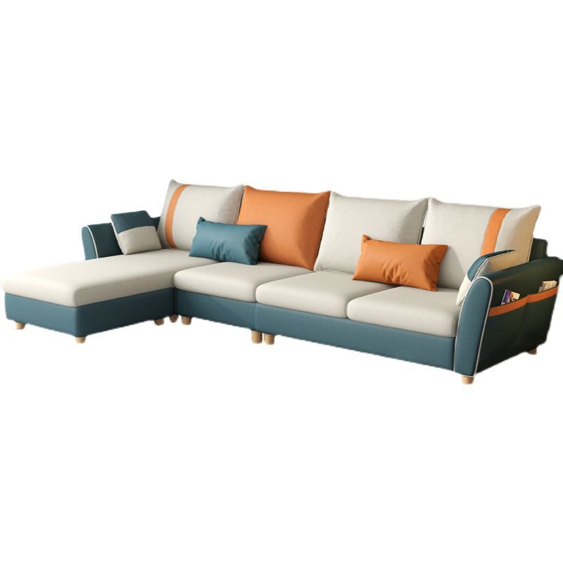 Scandinavian Faux Leather Sectional with Four Pillows Back and Storage