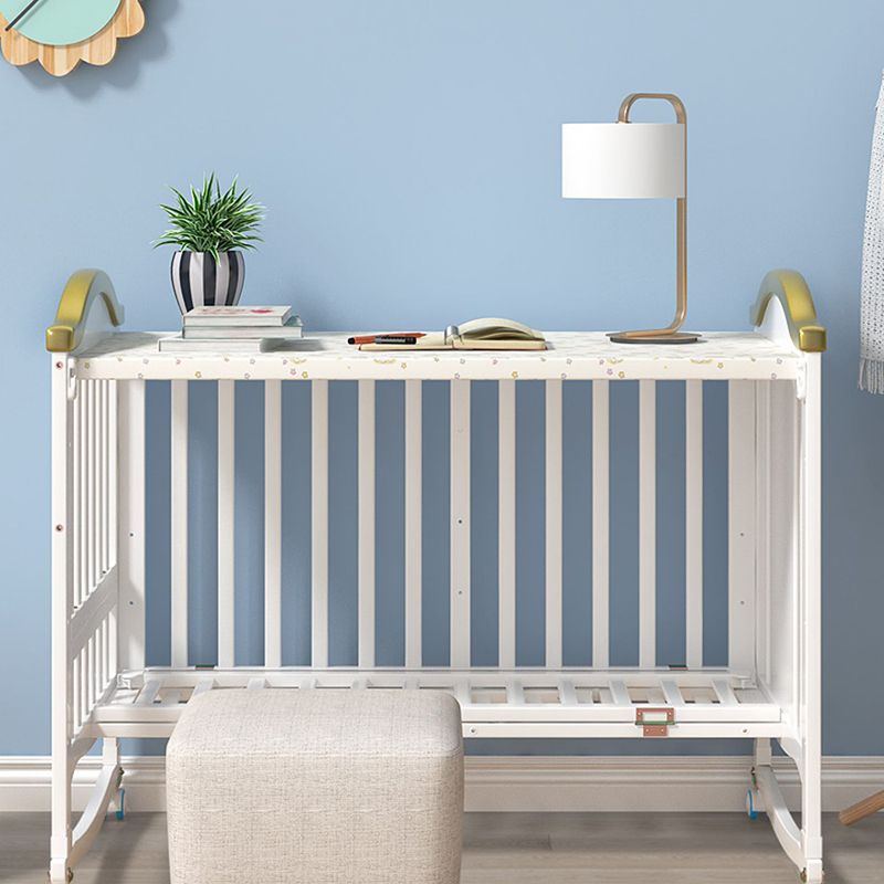 Scandinavian Convertible Crib in White 4-in-1 Nursery Crib with 2 Casters and Storage