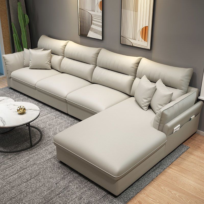 Faux Leather Sectional with Four Pillows Back Flared Arm Sofa