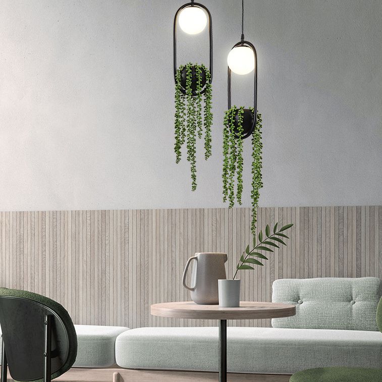 Zwart 1 Licht bolvormig Hanglamp Lichte Noordse retro ovale metalen ringschaduwhanglamp met groene plant