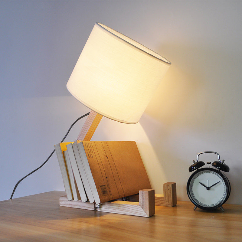 Lampe de table en forme d'homme Nouveauté en bois moderne Single Single Béges / noir / blanc Lumière de nuit avec conception de rack de livres et nuance de tissu de cylindre