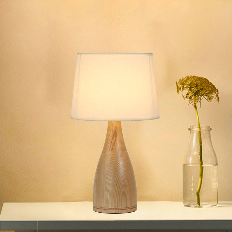 Tapered Drum Night Light Minimal Fabric Single Bedside Table Lighting with Vase Pedestal in Wood