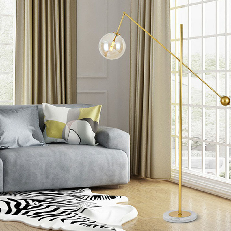 Brass Plated Balance Arm Floor Light Postmodern 1-Light Metal Stand Up Lamp with Spherical Glass Shade