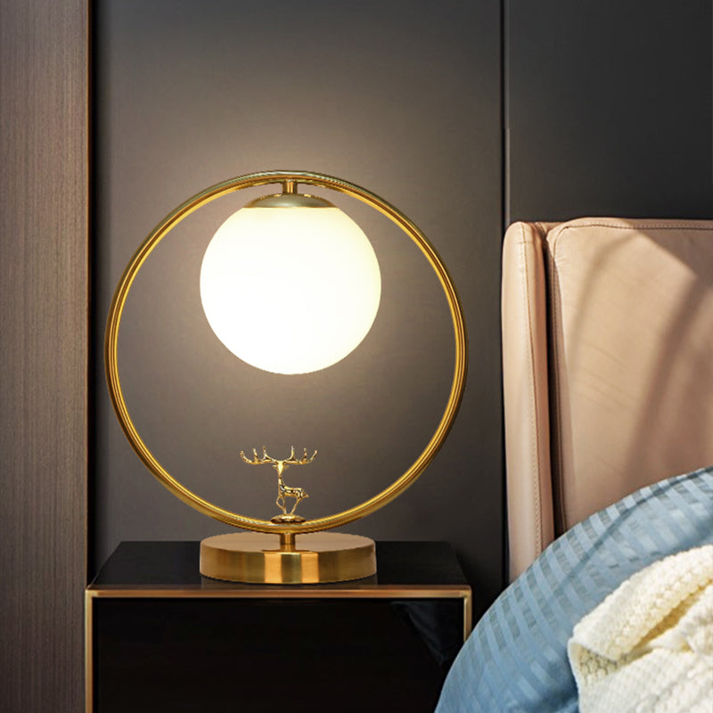 Ivory Glass Ball Table Light Simple Style 1-Light Gold Night Lamp with Metal Ring and Deer Deco