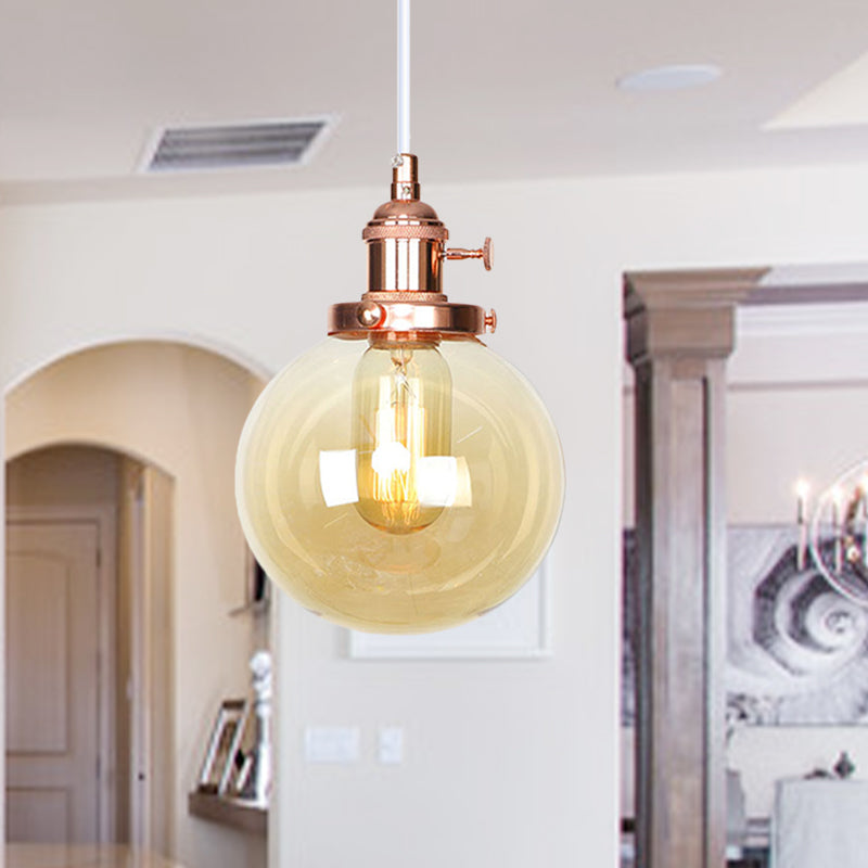 Orbit Hanging Lighting Farmhouse Amber/Clear Glass 1 bol hanglamp met verstelbaar koord in zwart/brons/messing afwerking