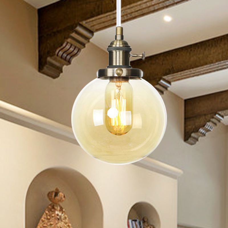 Orbit Hanging Lighting Farmhouse Amber/Clear Glass 1 bol hanglamp met verstelbaar koord in zwart/brons/messing afwerking