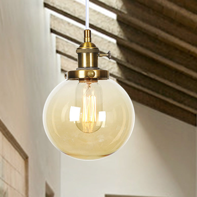 Orbit Hanging Lighting Farmhouse Amber/Clear Glass 1 bol hanglamp met verstelbaar koord in zwart/brons/messing afwerking