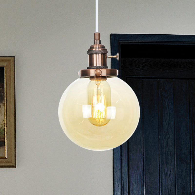 Orbit Hanging Lighting Farmhouse Amber/Clear Glass 1 bol hanglamp met verstelbaar koord in zwart/brons/messing afwerking