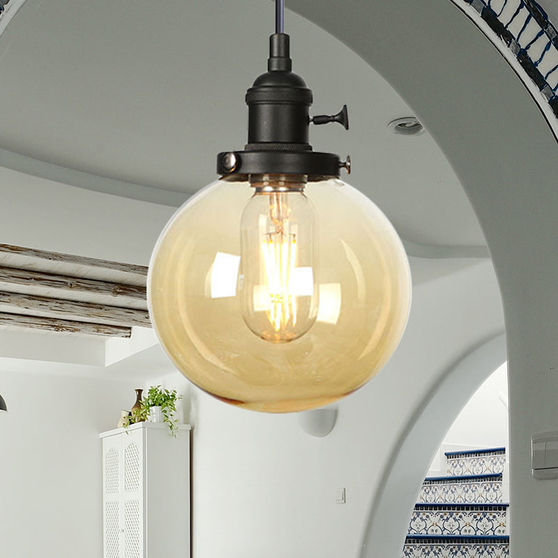 Orbit Hanging Lighting Farmhouse Amber/Clear Glass 1 bol hanglamp met verstelbaar koord in zwart/brons/messing afwerking