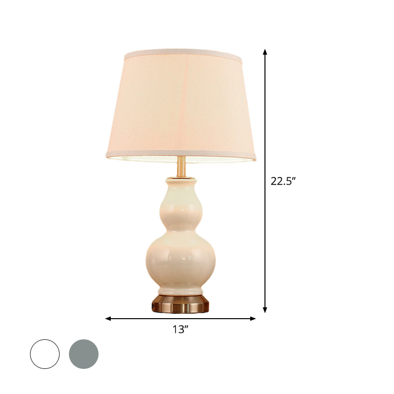 Compito curvo luce ceramica moderna 1 lampadina rosa/bianco lampada da comodino con tonalità in tessuto, 13 "/16" di larghezza