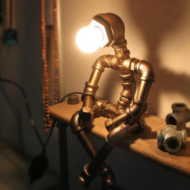 Retro -Stil Eisenrohr Tischlampe Roboterform 1 Leuchttischlampe für Schlafzimmer