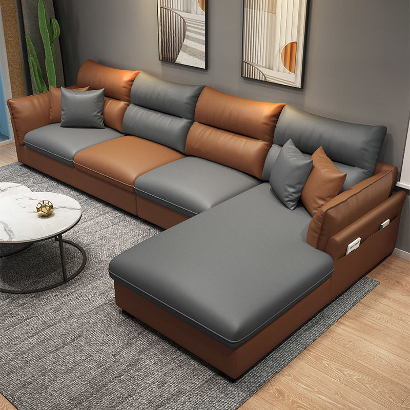 Faux Leather Sectional with Four Pillows Back Flared Arm Sofa