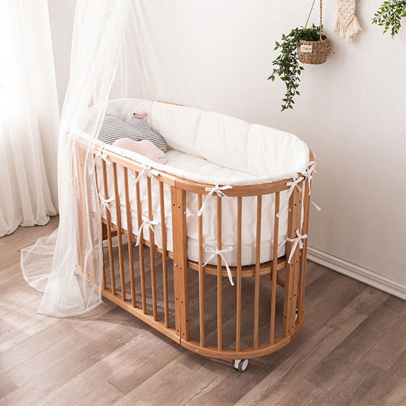 Oval Solid Wood Crib Nordic Style 5-In-1 Convertible Crib with Casters