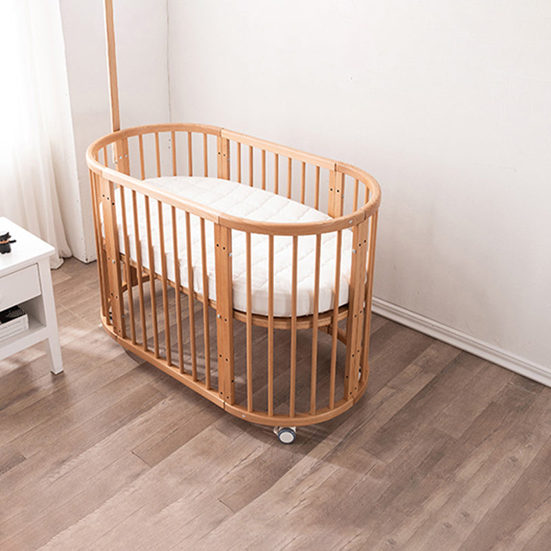 Oval Solid Wood Crib Nordic Style 5-In-1 Convertible Crib with Casters